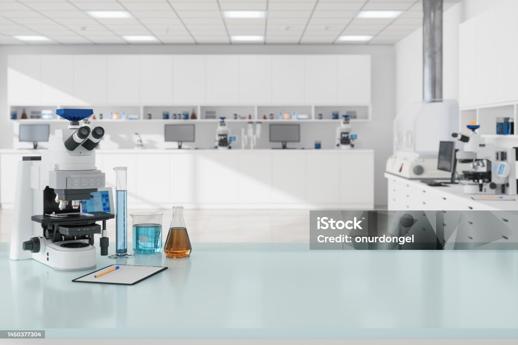 Close-up view Of Microscope And Laboratory Equipments On Empty Desk In Science Laboratory Laboratory Stock Photo