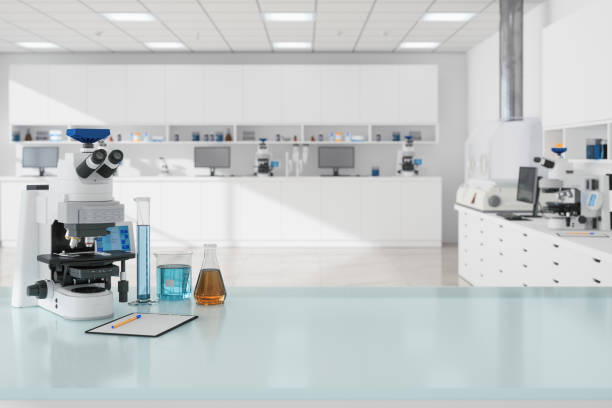 Close-up view Of Microscope And Laboratory Equipments On Empty Desk In Science Laboratory stock photo