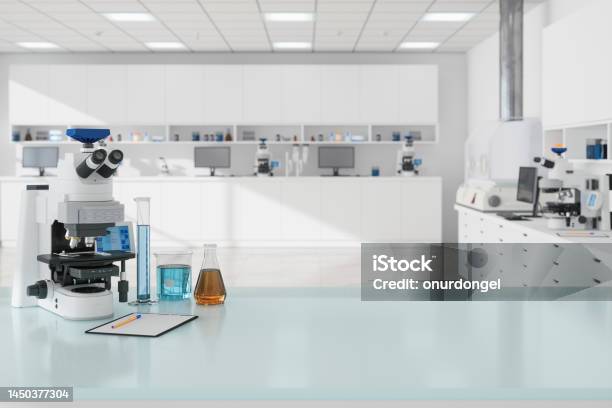 Closeup View Of Microscope And Laboratory Equipments On Empty Desk In Science Laboratory Stock Photo - Download Image Now