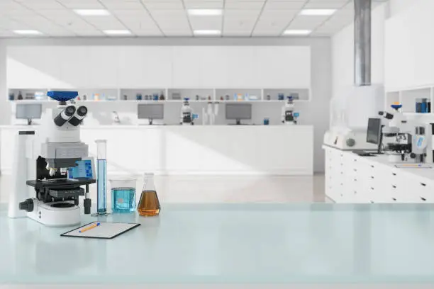 Photo of Close-up view Of Microscope And Laboratory Equipments On Empty Desk In Science Laboratory