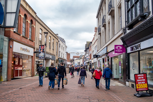 Groups of shoppers walking along Tavern Street in Ipswich, Suffolk, Eastern England.