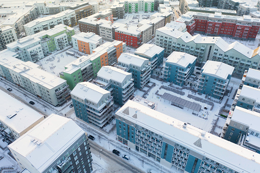 Aerial view of streets with modern apartment buildings on a winter day in the Järfälla municipality outside Stockholm.