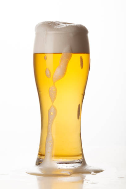 istock Glass of light beer isolated on white background 1450381007