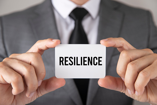 Businessman is holding resilience business card