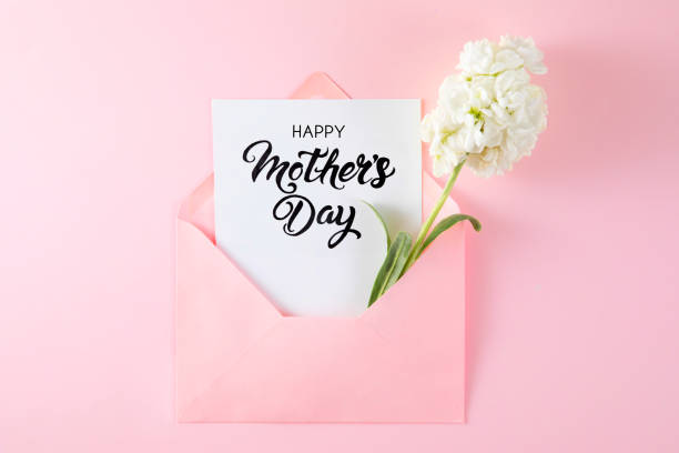istock White Flowers with White Greeting Card in Pink Envelope 1450382891