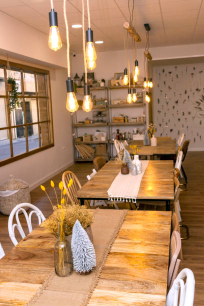 istock Vertical shot of Creative studio. Work tables with chairs of different styles. 1450385153