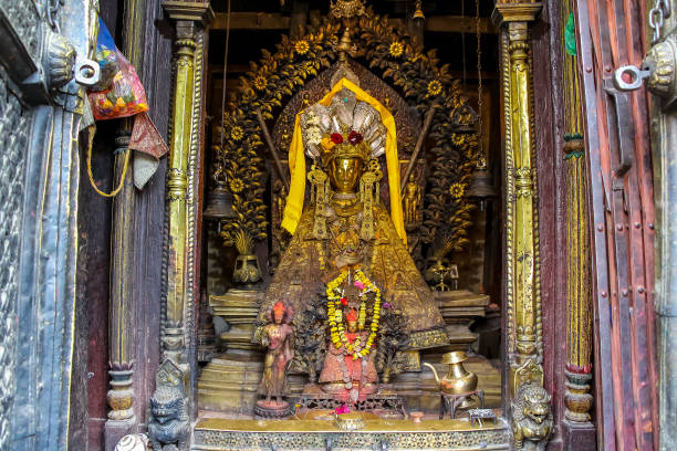 istock Small golden Buddha statue in buddhist temple 1450388207