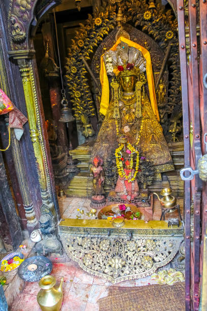 istock Small golden Buddha statue in buddhist temple 1450388213