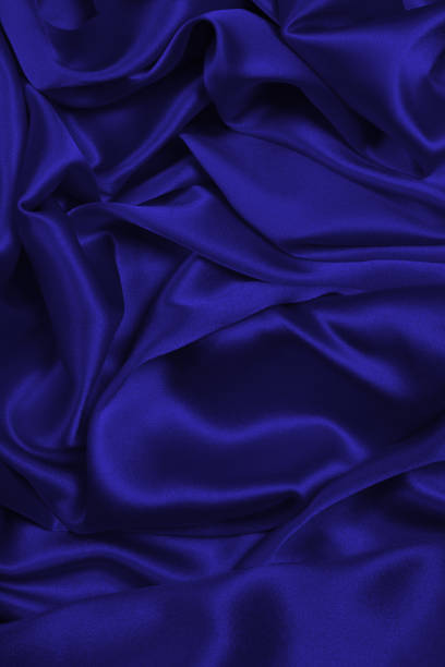 istock Rich and luxury red silk fabric texture background. 1450388941