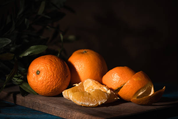 istock Close up on oranges on rustic wooden table. 1450392020