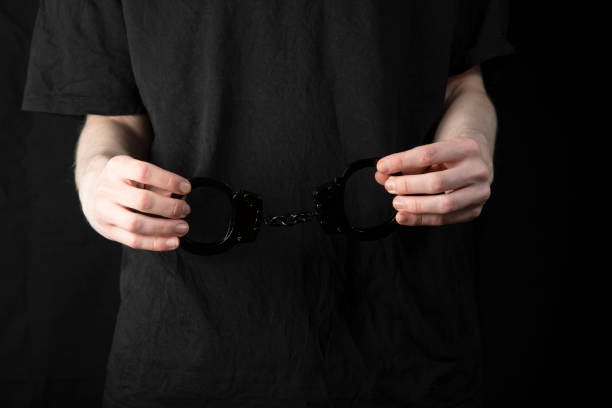 istock A man, a criminal in handcuffs. 1450394893
