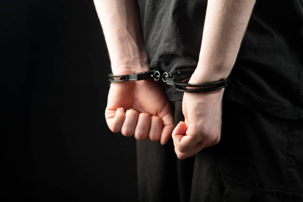istock A man, a criminal in handcuffs. 1450394926