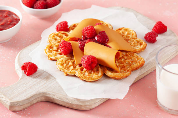 istock waffles with Norwegian brunost traditional brown cheese and raspberry jam 1450395115
