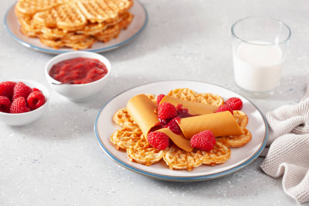 istock waffles with Norwegian brunost traditional brown cheese and raspberry jam 1450395162