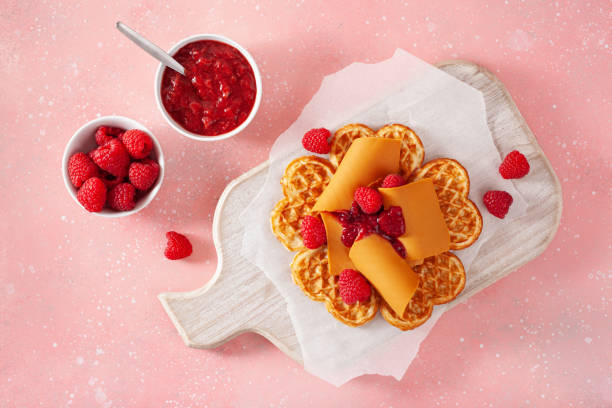 istock waffles with Norwegian brunost traditional brown cheese and raspberry jam 1450395216