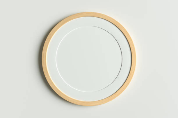 Wooden round frame poster mock up on the white wall.