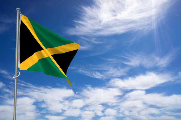 istock Jamaica flags over blue sky background. 3D illustration 1450399104