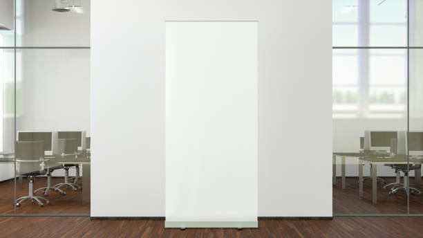istock Blank roll up banner stand mock up in modern office. 1450399378