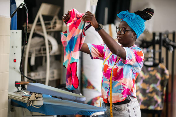 istock African fashion designer ironing clothes in studio 1450399574