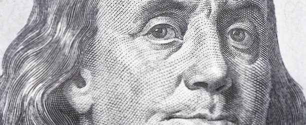 istock Benjamin Franklin's look on a hundred dollar bill. Benjamin Franklin portrait macro usa dollar banknote or bill 1450400850