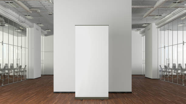 istock Blank roll up banner stand mock up in modern office. 1450401459