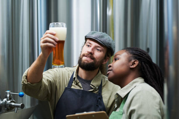 istock Brewery Workers Checking Beer Froth 1450402540
