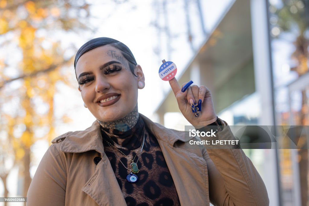 Just Voted A non binary person person showing their "I voted" sticker Adult Stock Photo