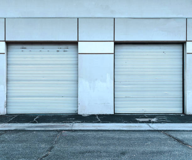istock commercial warehouse shipping garage shipment roll up door loading dock storage 1450405881