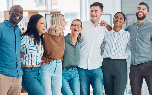 Teamwork, friends and funny with business people laughing together in their office at work. Collaboration, happy and success with a man and woman employee group joking while working as a team
