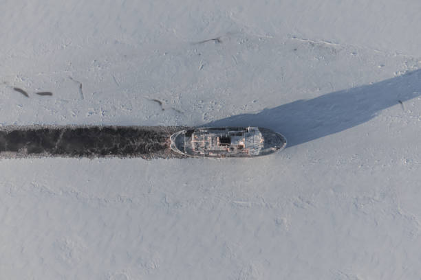 An icebreaker makes a channel in the ice. Top view.