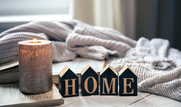 istock Composition with decorative word home and candle on blurred background. 1450407324