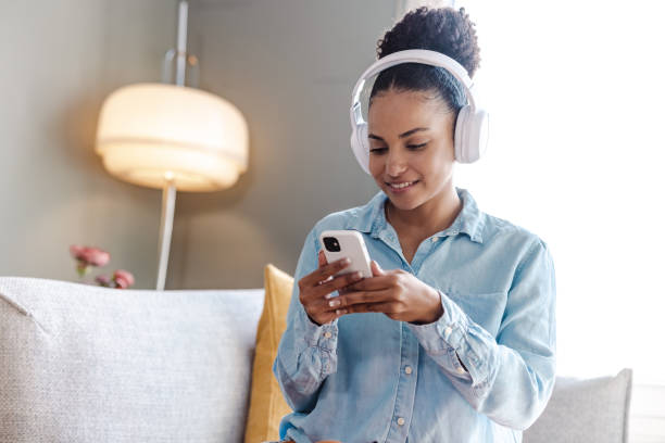 istock A young beautiful woman consuming internet content on a smart phone 1450421654