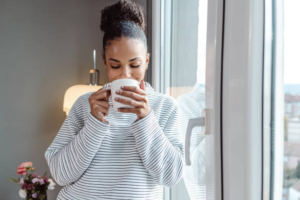 istock A young beautiful woman using a smart phone at home 1450423054
