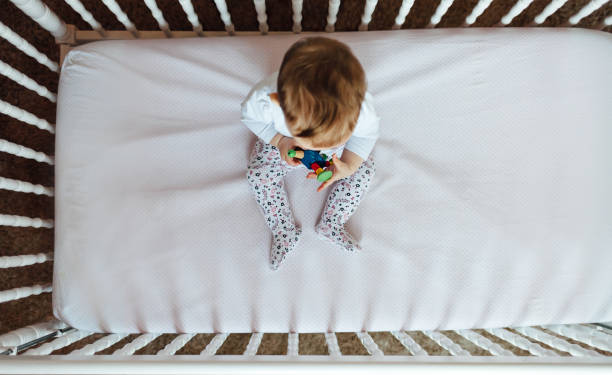 istock Cute baby in crib 1450435016
