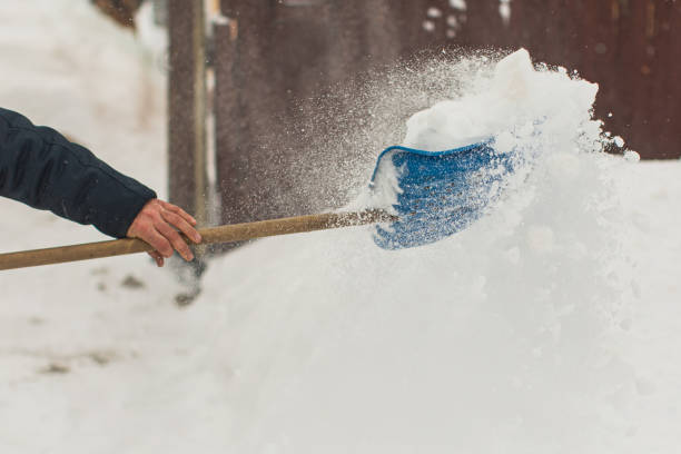 istock Snow shovel. Winter background. 1450443240