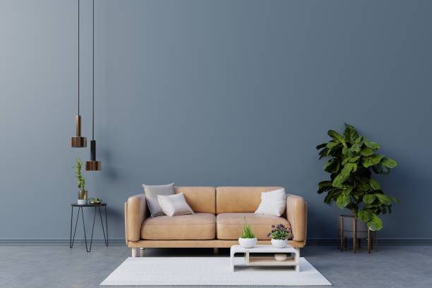istock Dark room with leather sofa on empty dark blue wall background. 1450443804