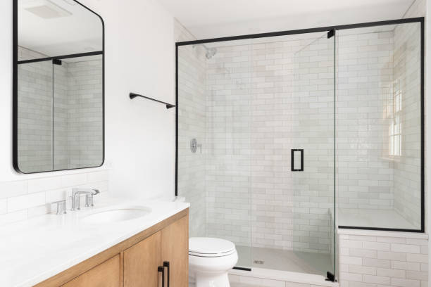 istock A bathroom with a wood cabinet and marble tiled shower. 1450444943