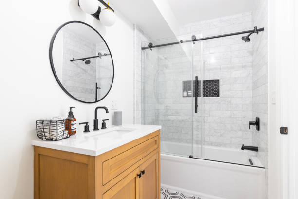 istock A bathroom with a wood cabinet and subway tile shower. 1450445673