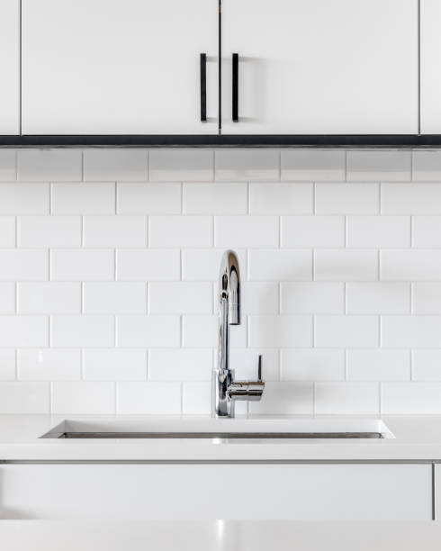 A white kitchen sink detail.
