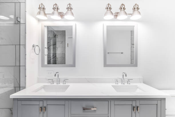 istock A bathroom with a grey cabinet and white marble countertop. 1450448831