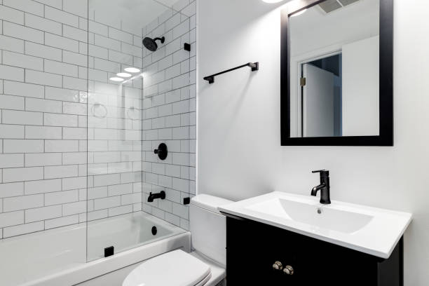 istock A bathroom with a black cabinet and subway tiles. 1450448841