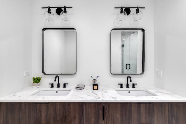 istock A bathroom with a wood cabinet and marble countertop. 1450448920