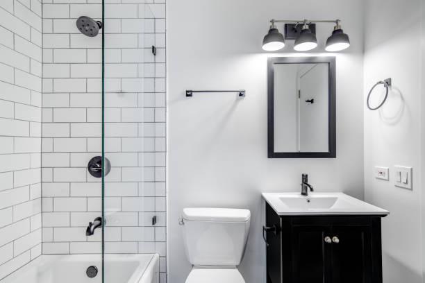 istock A bathroom with a black cabinet and subway tiles. 1450449154