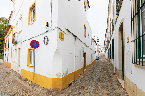 Evora, Portugal- October 24,2022: Street view of ancient Evora UNESCO World Heritage Site with history dating back five millenia.