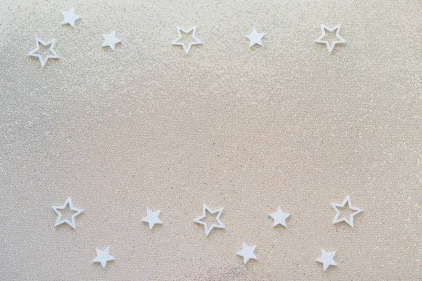 istock Gold glitter party background with white stars. shine 1450480653