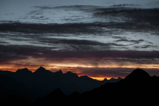 istock Silhouette of mountains under colorful sky during sunset 1450494613