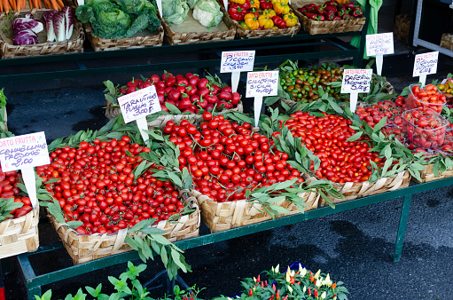 Stall with tomatoes on the market. Italian traditions. Horizontal orientation.