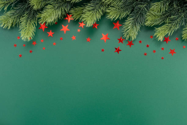 istock Christmas Decorations with stars confetti on green background. Holiday pattern background. 1450505441