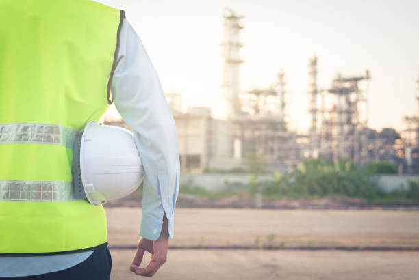 istock business people looking at Refineries and Petroleum 1450506534