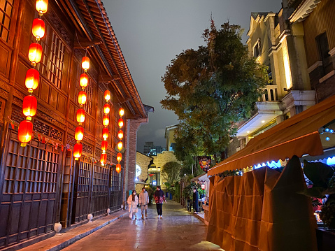 Kunming, Yunnan- December 17, 2022:  Kunming is the capital of Yunnan Province in Southwest border of China. Because the mild climate, it is called the City of Spring and an attractive travel destination. Here is the ancient Qianwang (King of Wealth) street.